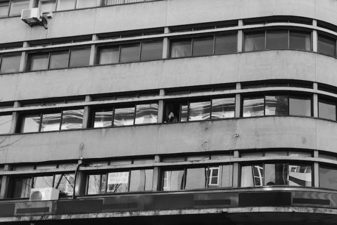 porto-woman-smoking-in-the-apartment-tower